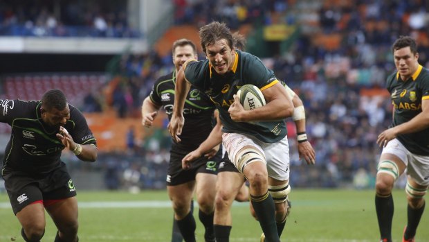 Springbok Eben Etzebeth on his way to scoring a try against the World XV rugby team in Cape Town, South Africa in July.