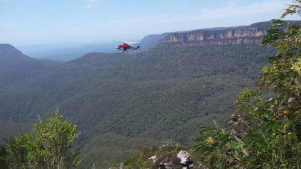 A helicopter surveys the scene after the accident.