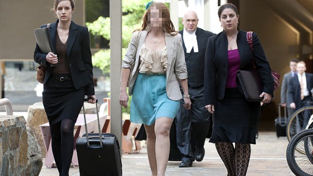 The mother of four girls at the heart of a custody dispute arrives at court today.