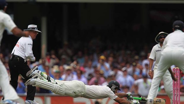 Full tilt ... Ricky Ponting dives for the single that brought up his century.