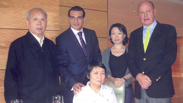 Yuan Xiao Rong, front centre, with former Keddies solicitor David Marocchi, centre.