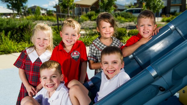 Three sets of twins (from back, left-right) Olivia and Dylan Bates, 5, Lola and Hugo Higgins, 5, and 
 David and Jules Haddock, 5 and a half, start their first day at school on Monday.