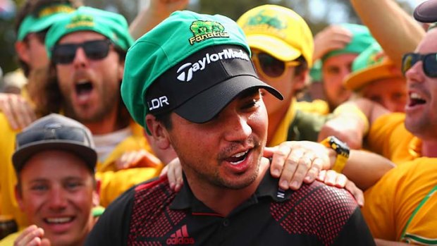 Jason Day celebrates his win with fans.