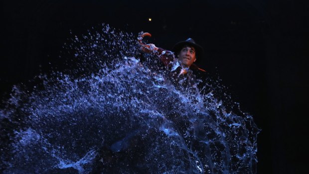 Making a splash: Adam Garcia performs during a production media call for Singin' In The Rain.