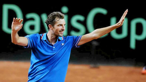 Clean sweep: France's Julien Benneteau celebrates after winning against Australia's Thanasi Kokkinakis in their Davis Cup first round match.