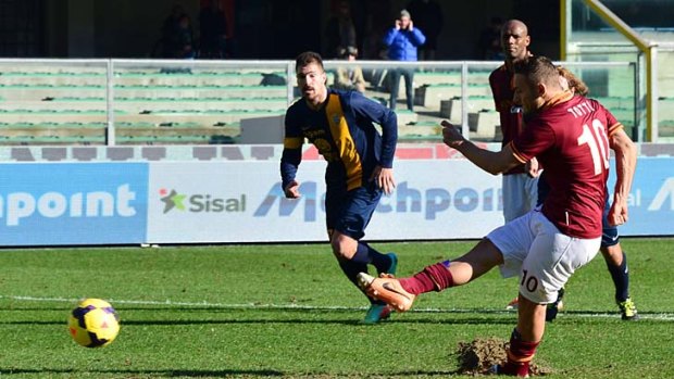AS Roma's forward Francesco Totti scores from the penalty spot against Hellas Verona.