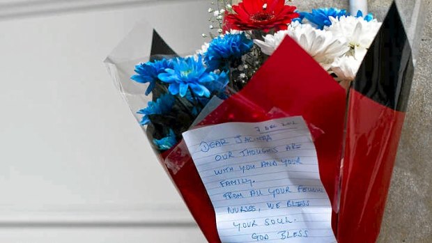 A bunch of flowers is left outside the nurses accommodation block by colleagues near the King Edward VII hospital in central London in memory of nurse Jacintha Saldanha.
