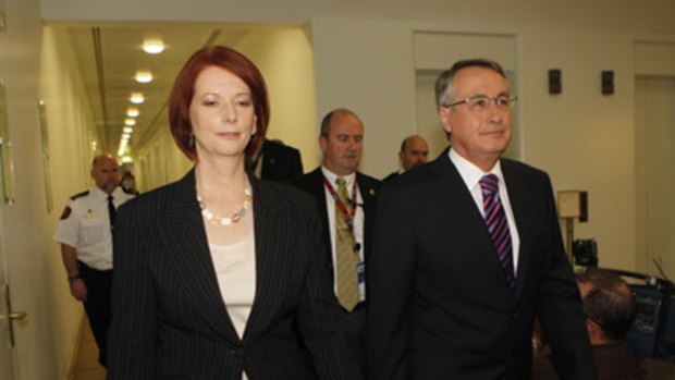 Julia Gillard and Wayne Swan enter today's Labor caucus meeting.