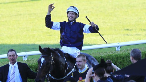 Triumphant: Hugh Bowman shows his delight after scoring the Sydney Cup with Mourayan.
