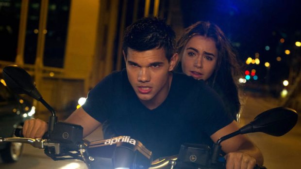 Rocky road ... Taylor Lautner and Lily Collins negotiate another false turn.