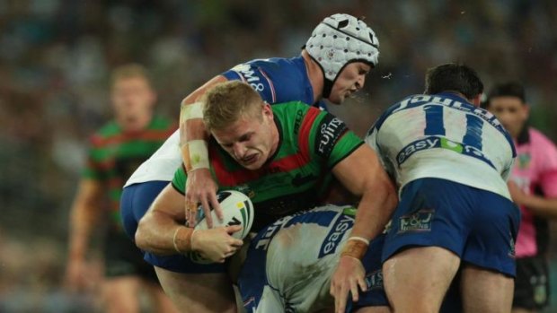 High-stakes struggle: Bulldogs players tackle George Burgess.