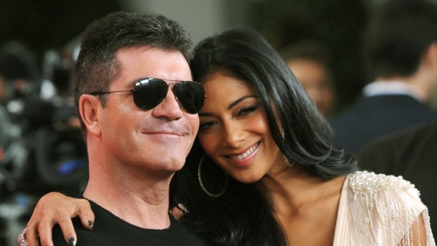 Rich and generous ... Simon Cowell with fellow X Factor judge Nicole Scherzinger.