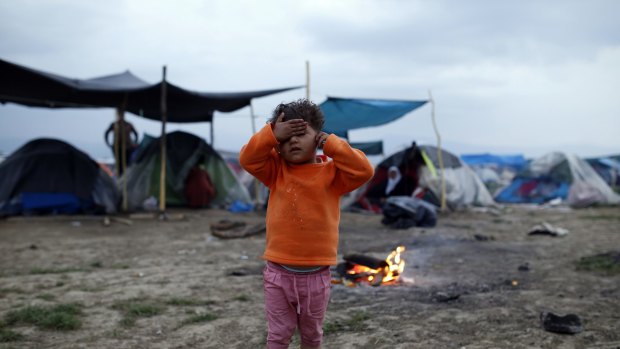 A migrant child at the northern Greek border point of Idomeni, Greece.