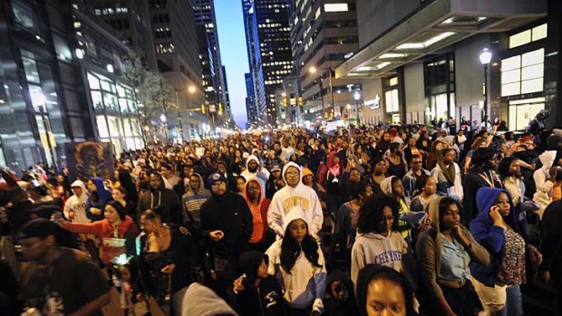 Thousands of people protest in Philadelphia as part of the 'Million Hoodie March' to support the family of Trayvon Martin.