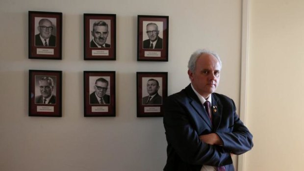 Democratic Labour Party MP no more: Senator John Madigan with portraits of former DLP politicians in his office.
