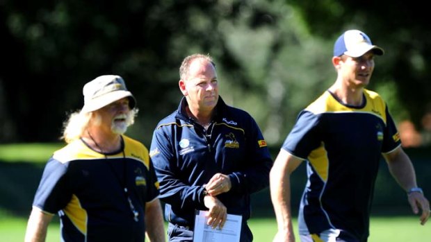 On hand &#8230; clockwise from above, Jake White with forwards coach Laurie Fisher, left, and backs coach Stephen Larkham.