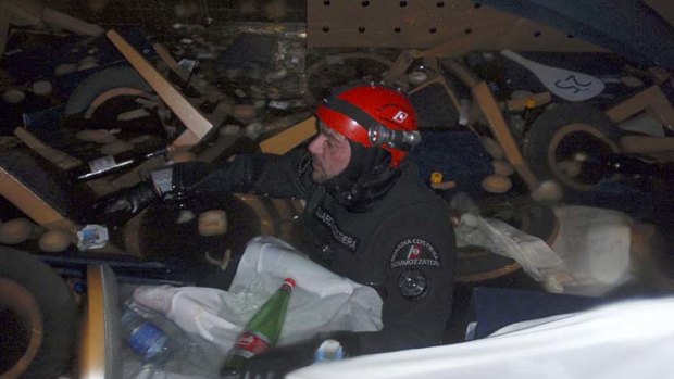 A diver inspects the inside of the Costa Concordia.