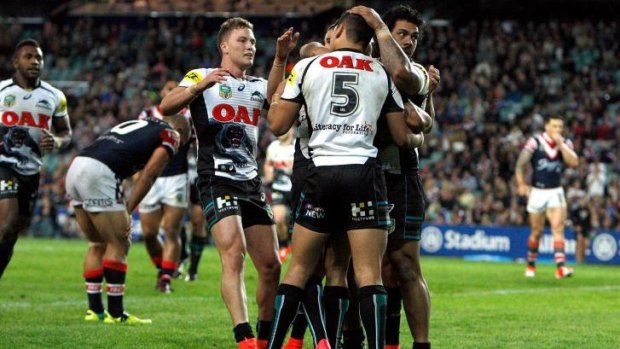 Upset: The Panthers celebrate during their dramatic win over the Roosters on Saturday.