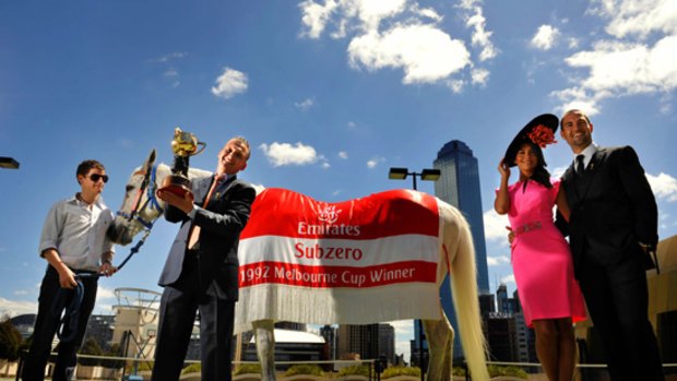 All together now ... 1992 Melbourne Cup winner Subzero with jockey Greg Hall (with Cup) his son and jockey Nicholas Hall (left) and Pia and Brad Miller (far right).