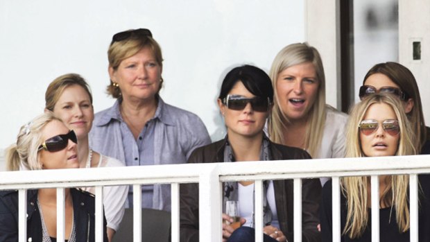 Among the cricket WAGs ...  Lara Bingle, far right, watches Australia play England at Lord's last July.