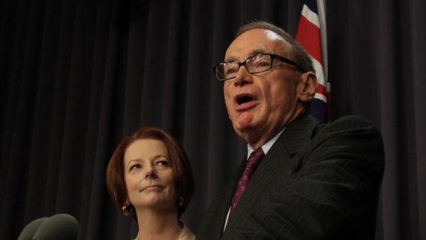 Prime Minister Julia Gillard watches on after announcing former NSW premier Bob Carr will become the new Foreign Affairs Minister.