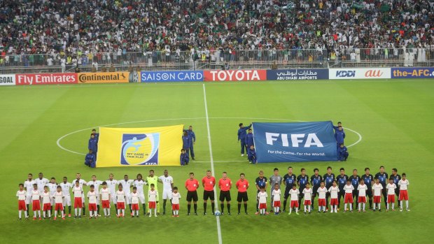 Japan and Saudi Arabia team players before the qualifying match.
