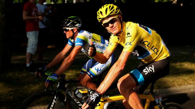 Still smiling: Chris Froome isn't letting doubters rain on his Tour de France celebrations.