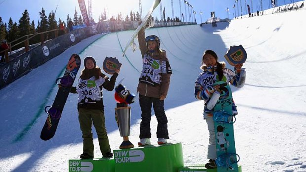 Kelly Clark (second), Torah Bright (first) and Chloe Kim (third) on the podium after the women's snowboard superpipe final at the Dew Tour Championships in Breckenridge, Colorado.