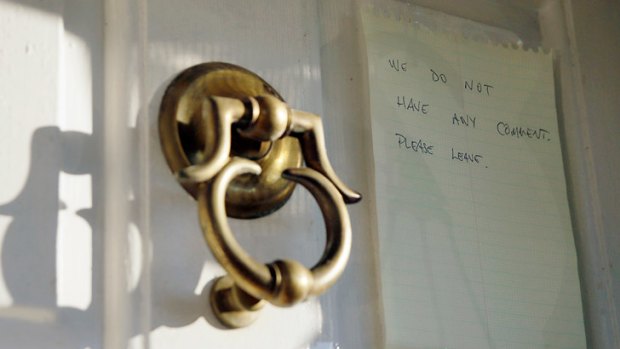 A note on the door of Breyer’s home in 2012. <i>Photo: AP</i>