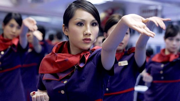 Flight attendants from Hong Kong Airlines undergoing self-defence training. A survey has found more than a quarter of flight attendants were sexually harassed in the past 12 months.