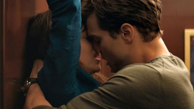 Dakota Johnson, left, and Jamie Dornan in <i>Fifty Shades of Grey</i>.