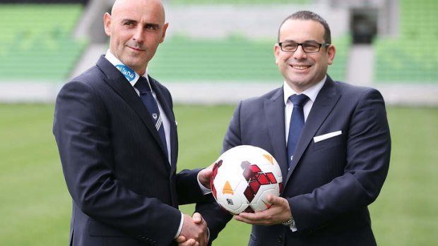 Torch passes: New Victory coach Kevin Muscat (L) shakes hands with Chairman Anthony Di Pietro.