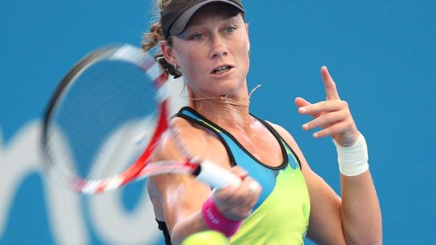 Samantha Stosur of Australia hits a shot during her first training session in Brisbane on December 28.