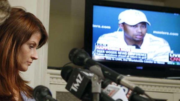 Angry ... Veronica Siwik-Daniels listens to Tiger Woods's press conference.