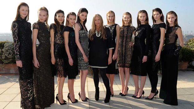 Models pose with fashion designer Collette Dinnigan during the 2013 Ready-to-Wear show as part of Paris Fashion Week at Le Meurice.