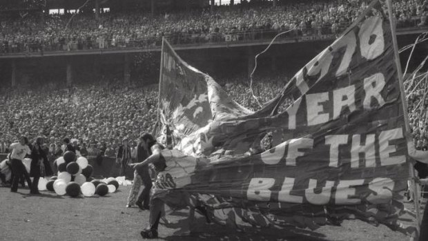 The lost tapes: Carlton players charge through the banner at the start of the 1970 grand final. Incredibly, Channel Seven taped over many old games in the 1980s and archival footage has been lost forever.