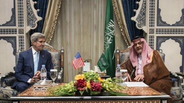 Uneasy allegiance: US Secretary of State John Kerry talks business with Saudi Foreign Minister Prince Saud al-Faisal in Jeddah, Saudi Arabia, on Thursday, September 11.