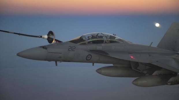 A RAAF F/A-18F Super Hornet receives fuel from a RAAF tanker in the skies over Iraq.