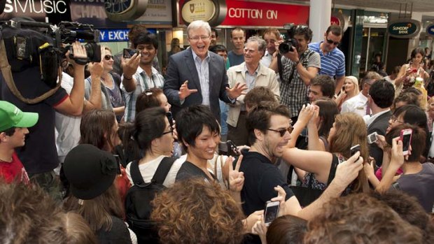 Kevin Rudd greeets people in Queen Street Mall in Brisbane yesterday.
