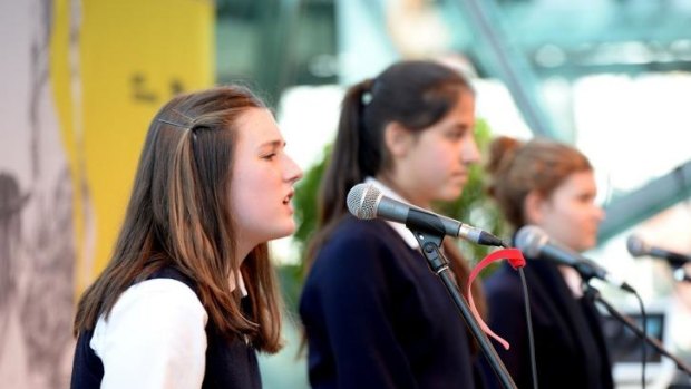Freedom of expression: Melbourne Girls College students, from left, Sophie Townsend, Stella Bourne and Nicola Braslis write about human rights for their performance poems.