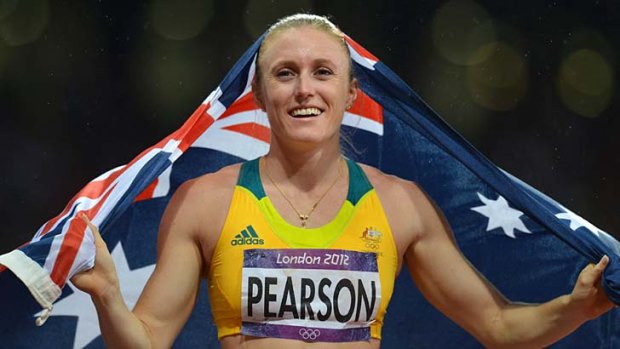Golden girl ... Sally Pearson after  winning her gold medal.