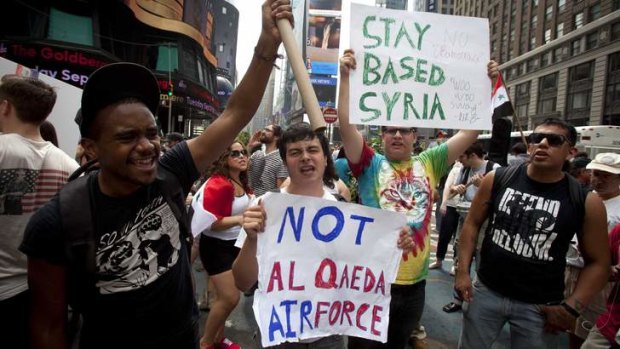 Unpopular: New Yorkers protest against proposed U.S. military action against Syria, in Times Square, August 31, 2013.    Reuters