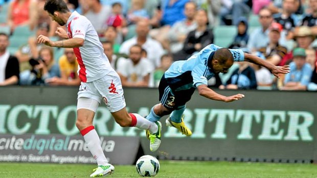 All ends up: Fabio Alves takes to the air for Sydney FC.