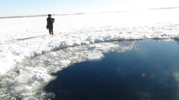 A hole in the ice of Chebarkul Lake where a fragment of an asteroid struck the lake near Chelyabinsk, Russia, in February 2013.