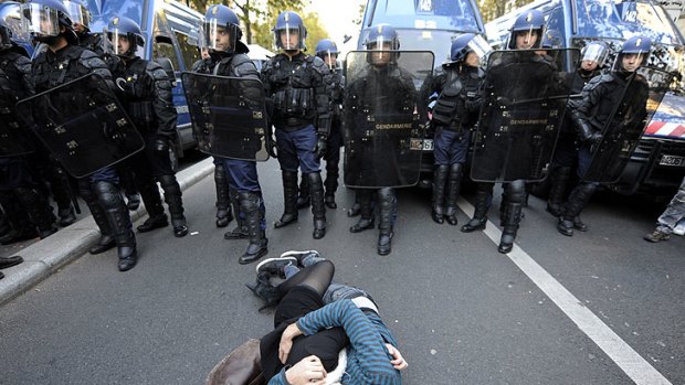 Look familiar? ... French high school students kiss on the road in front of the police at the end of a demonstration over pension reform in Paris October 21, 2010.