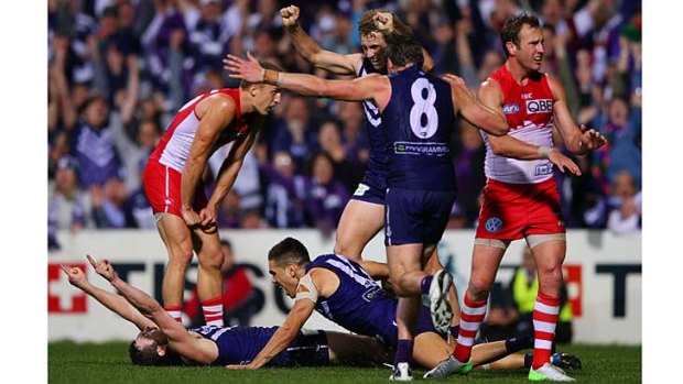 Jubilant Fremantle players celebrate a goal as they stormed into the grand final with a stirring win over Sydney.