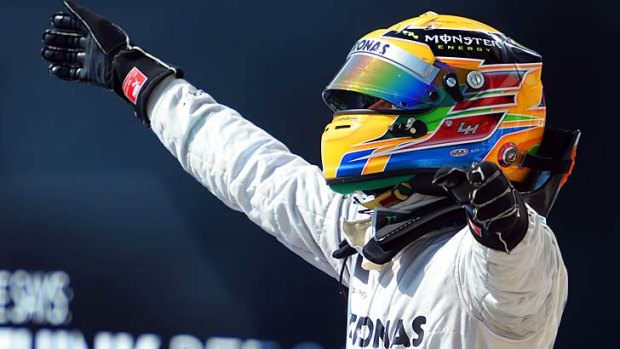 Lewis Hamilton celebrates in the parc ferme after winning the Hungarian Formula One Grand Prix at Hungaroring on Sunday.