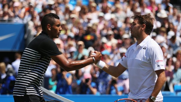 Switzerland's Stanislas Wawrinka, right, shakes hands with Australia's Nick Kyrgios at the Aegon Championships at Queen's Club in England last year. 