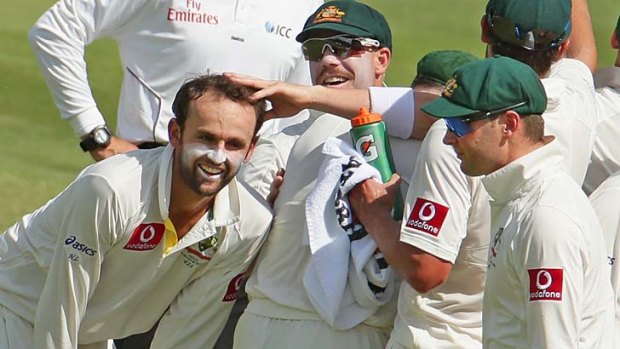 Lyon king: Nathan Lyon is congratulated after taking a South African wicket.