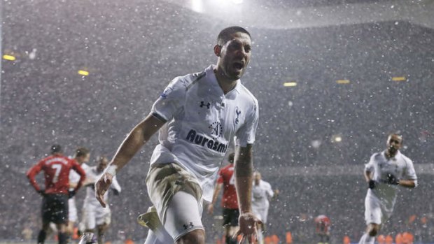 Fun in the snow ... Clint Dempsey celebrates his goal.